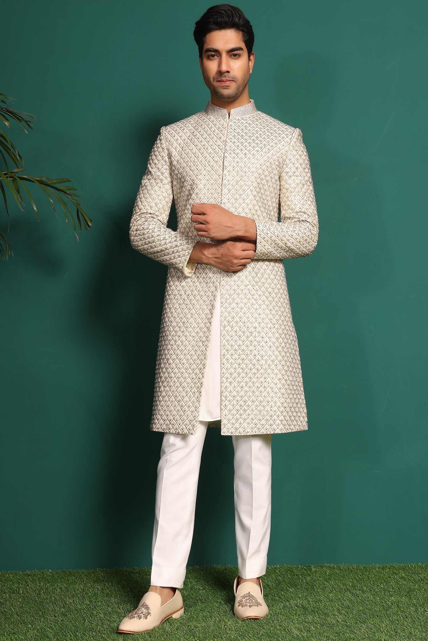 Ivory White Sherwani heavily embellished with moti and cutdaana