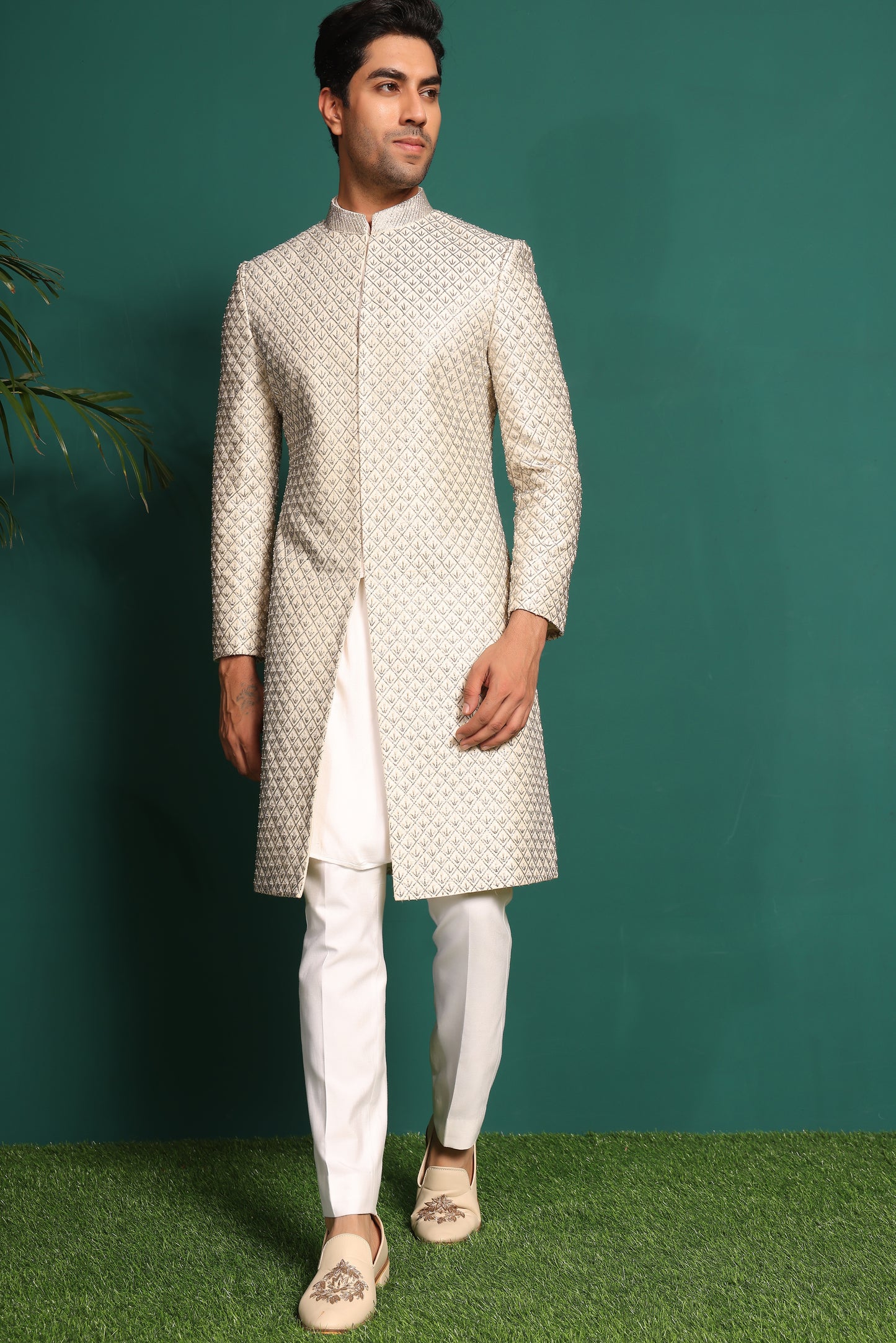 Ivory White Sherwani heavily embellished with moti and cutdaana